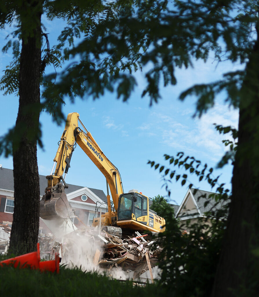 An excavator demolishes MU’s Alpha Phi house